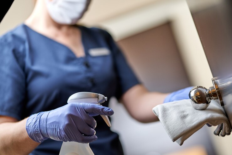 maid mask doing disinfecting door handle hotel 386167 8013